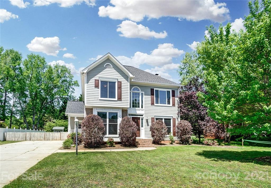 1999 Steeplechase Drive Rock Hill, SC 29732 - Photo 3 of 34 a front view of a house with a garden and plants