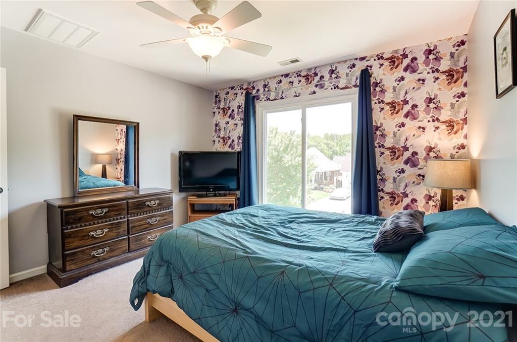 1999 Steeplechase Drive Rock Hill, SC 29732 - Photo 25 of 34 a bedroom with a bed and a flat screen tv