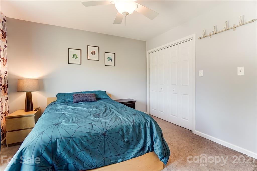 1999 Steeplechase Drive Rock Hill, SC 29732 - Photo 26 of 34 a bedroom with a bed and a lamp