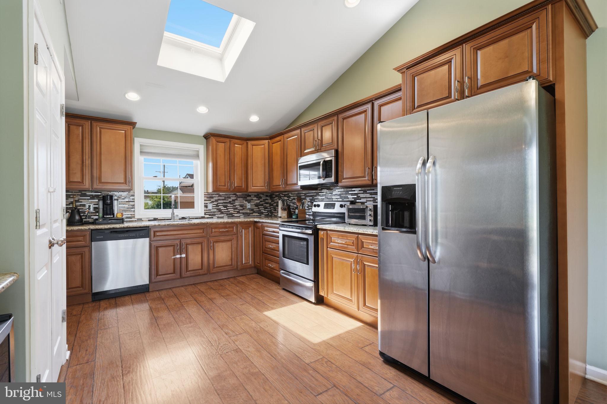 59 Iroquois Road Levittown, PA 19057 - Photo 5 of 25 Beautiful kitchen with skylight and valuted ceilin