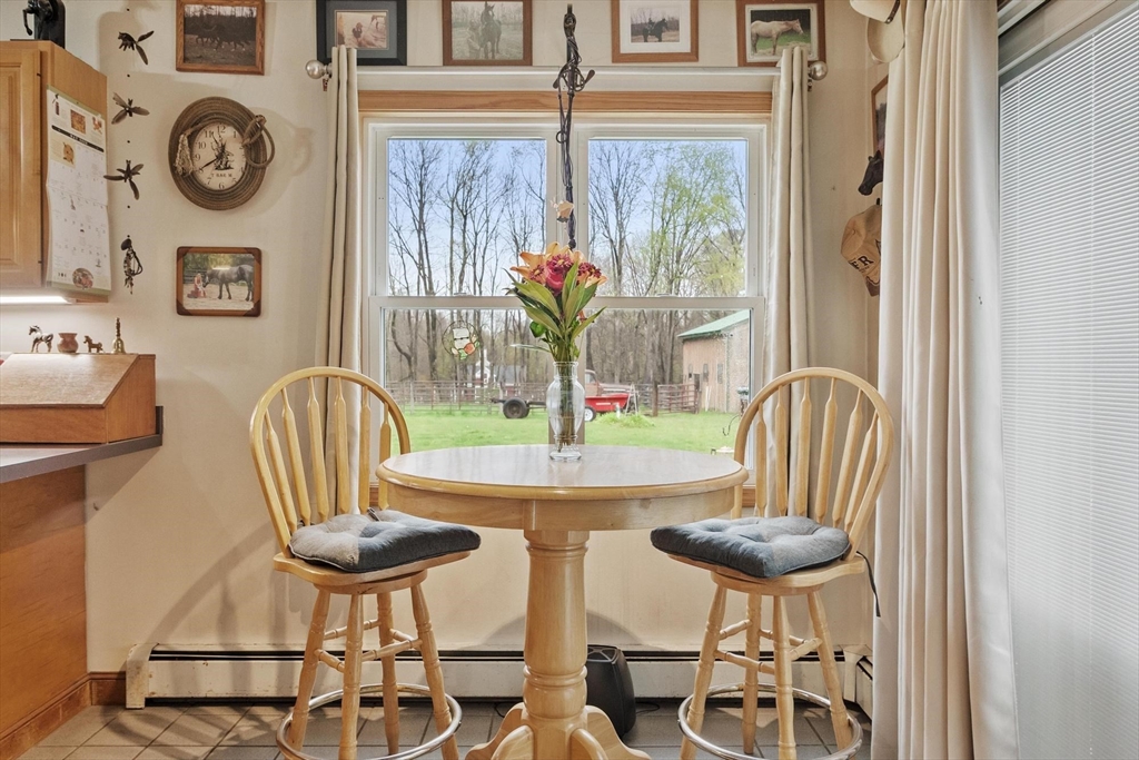340 Ball Hill Road Princeton, MA 01541 - Photo 24 of 41 a view of a dining room with furniture a chandelier and wooden floor