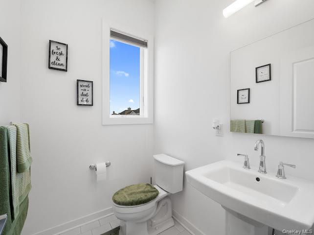 11 Island Point Bronx, NY 10464 - Photo 13 of 20 a bathroom with a sink toilet and a mirror