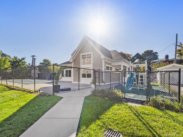 11 Island Point Bronx, NY 10464 - Photo 16 of 20 a front view of a house with a yard table and chairs
