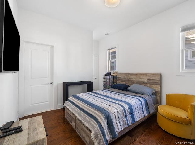 11 Island Point Bronx, NY 10464 - Photo 17 of 20 a bedroom with a bed and a couch