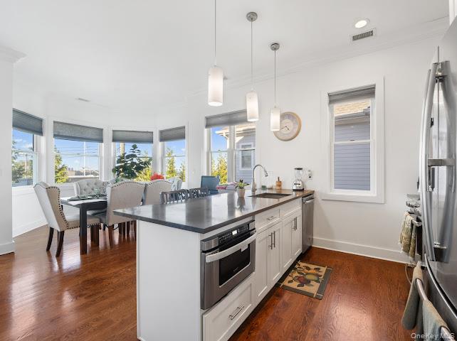 11 Island Point Bronx, NY 10464 - Photo 2 of 20 a large kitchen with a table and chairs