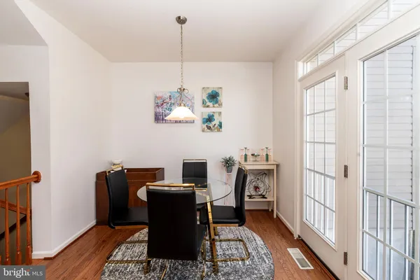 a kitchen with granite countertop stainless steel appliances a stove top oven a sink a counter space and cabinets