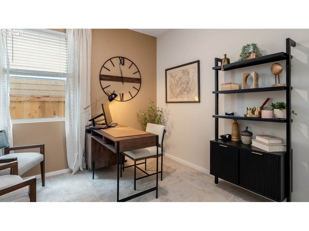 1095 Stubb Road Northeast Woodburn, OR 97071 - Photo 14 of 37 a living room with a table and a painting on the wall