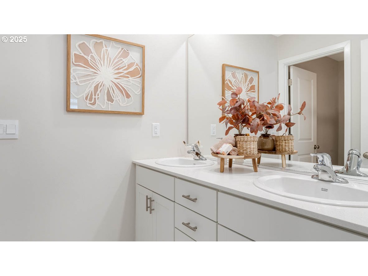 1095 Stubb Road Northeast Woodburn, OR 97071 - Photo 20 of 37 a bathroom with a sink and a mirror