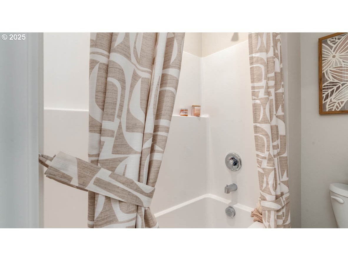 1095 Stubb Road Northeast Woodburn, OR 97071 - Photo 21 of 37 a bathroom with a sink toilet and shower