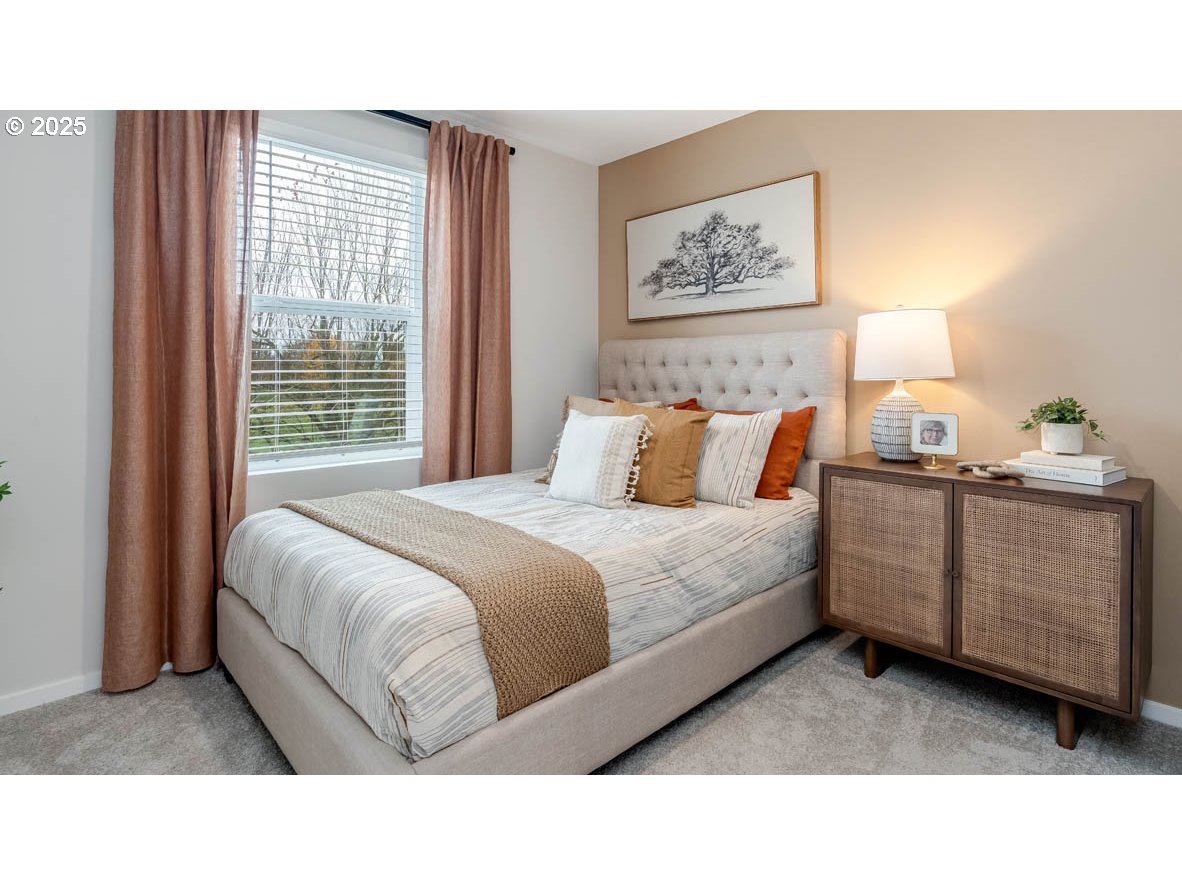 1095 Stubb Road Northeast Woodburn, OR 97071 - Photo 22 of 37 a bedroom with a bed and a painting on the wall