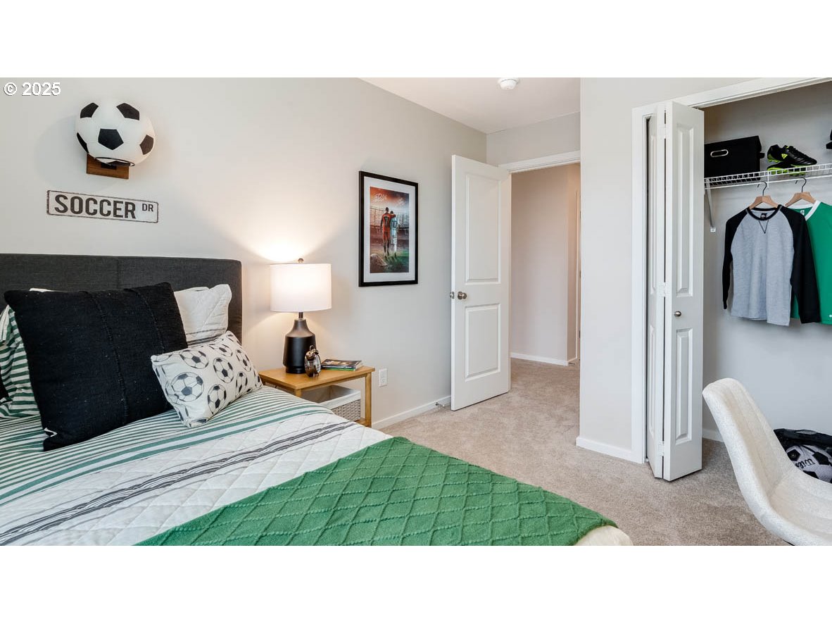 1095 Stubb Road Northeast Woodburn, OR 97071 - Photo 25 of 37 a bedroom with a bed and a television
