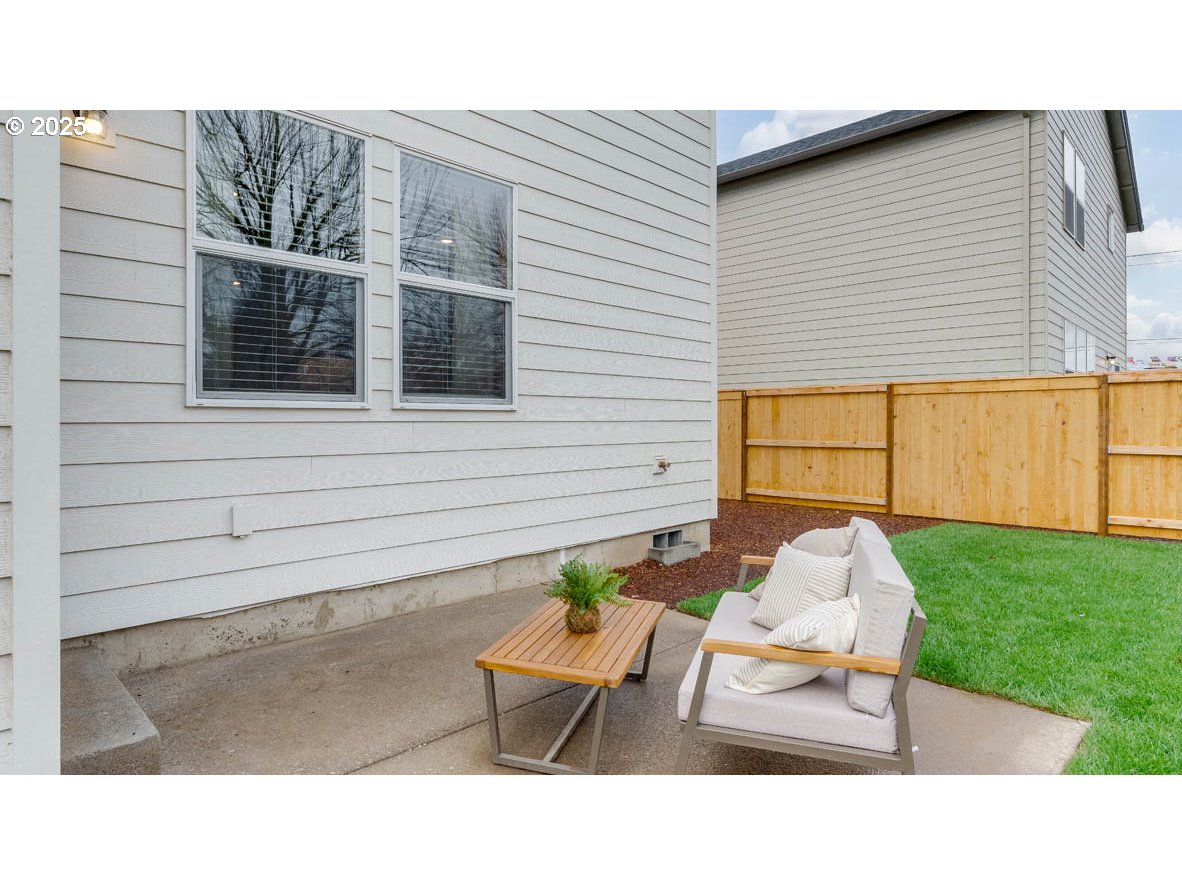 1095 Stubb Road Northeast Woodburn, OR 97071 - Photo 35 of 37 a couple of chairs sitting in backyard of house