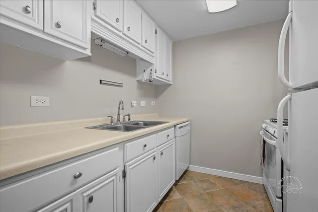 a kitchen with a sink and cabinets