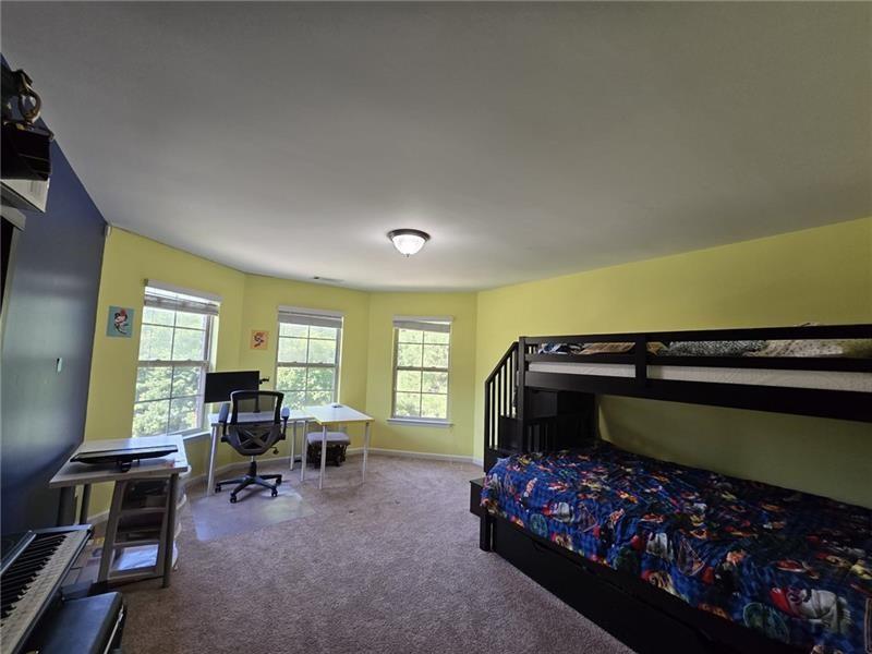 6850 Rocking Horse Lane Cumming, GA 30040 - Photo 15 of 36 a bedroom with furniture and a window