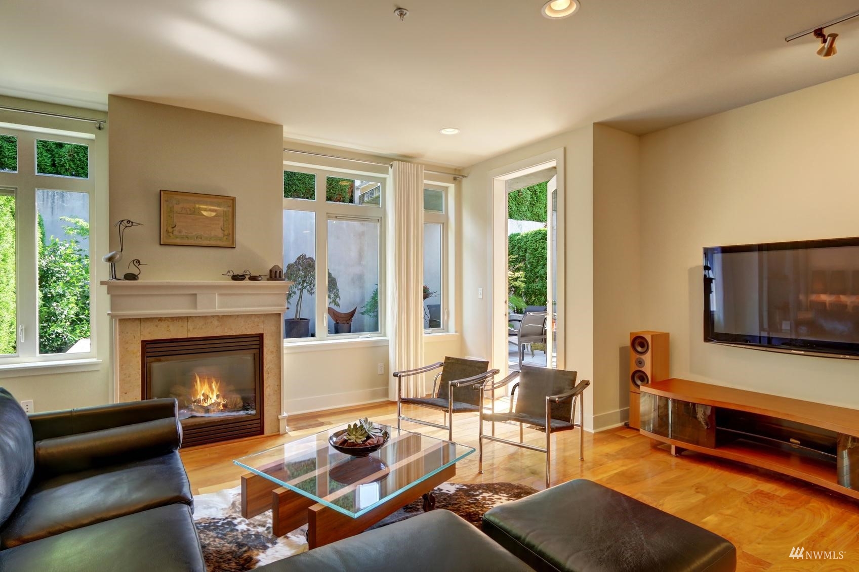 a living room with furniture flat screen tv and a fireplace