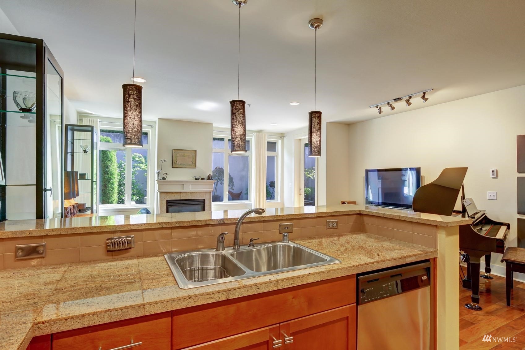 41 Pine Street, Unit 213 Edmonds, WA 98020 - Photo 11 of 25 a kitchen that has a sink and a large window
