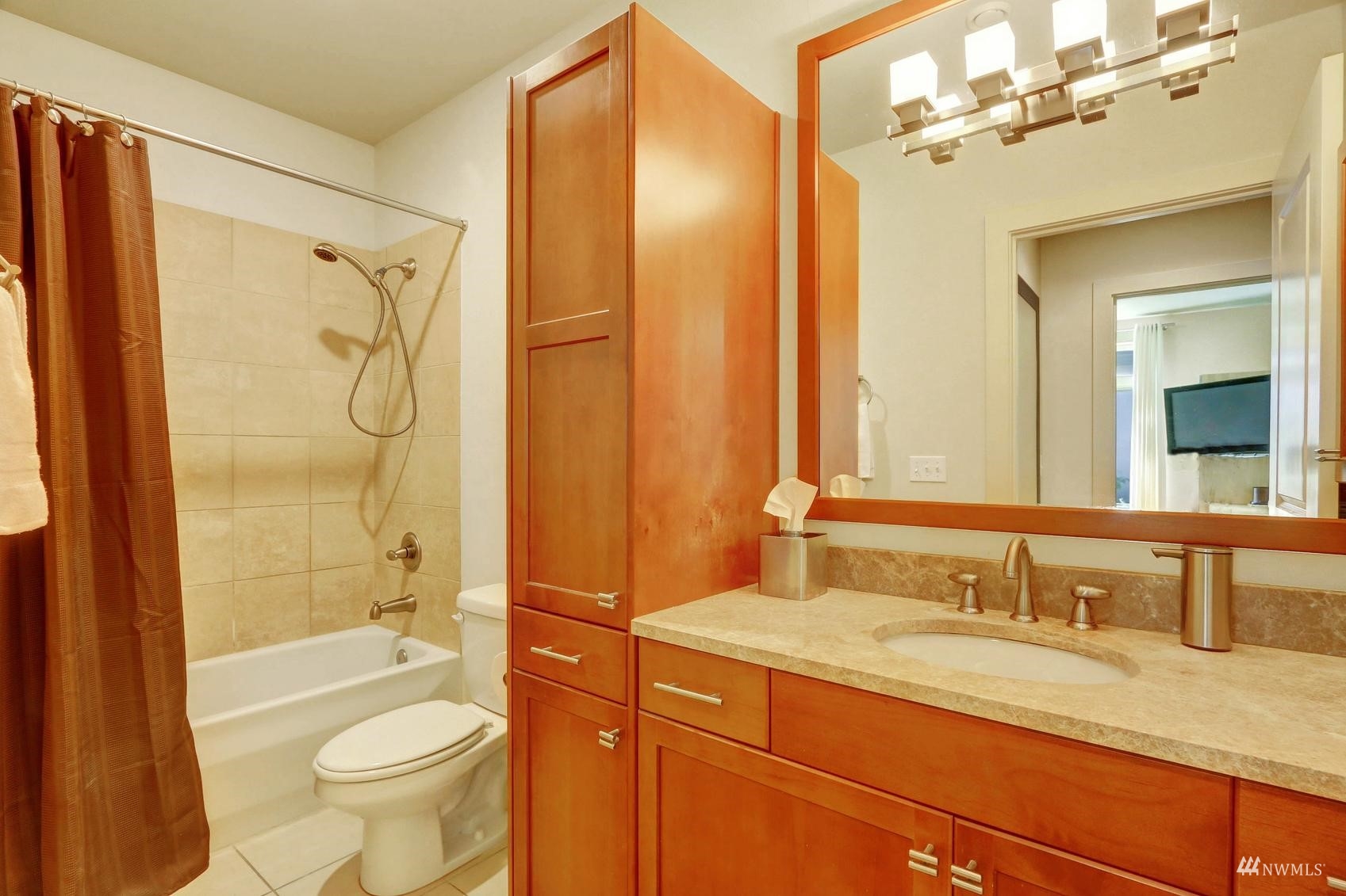 41 Pine Street, Unit 213 Edmonds, WA 98020 - Photo 17 of 25 a bathroom with a granite countertop sink toilet and shower