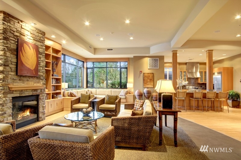 41 Pine Street, Unit 213 Edmonds, WA 98020 - Photo 22 of 25 a living room with furniture large window and a fireplace