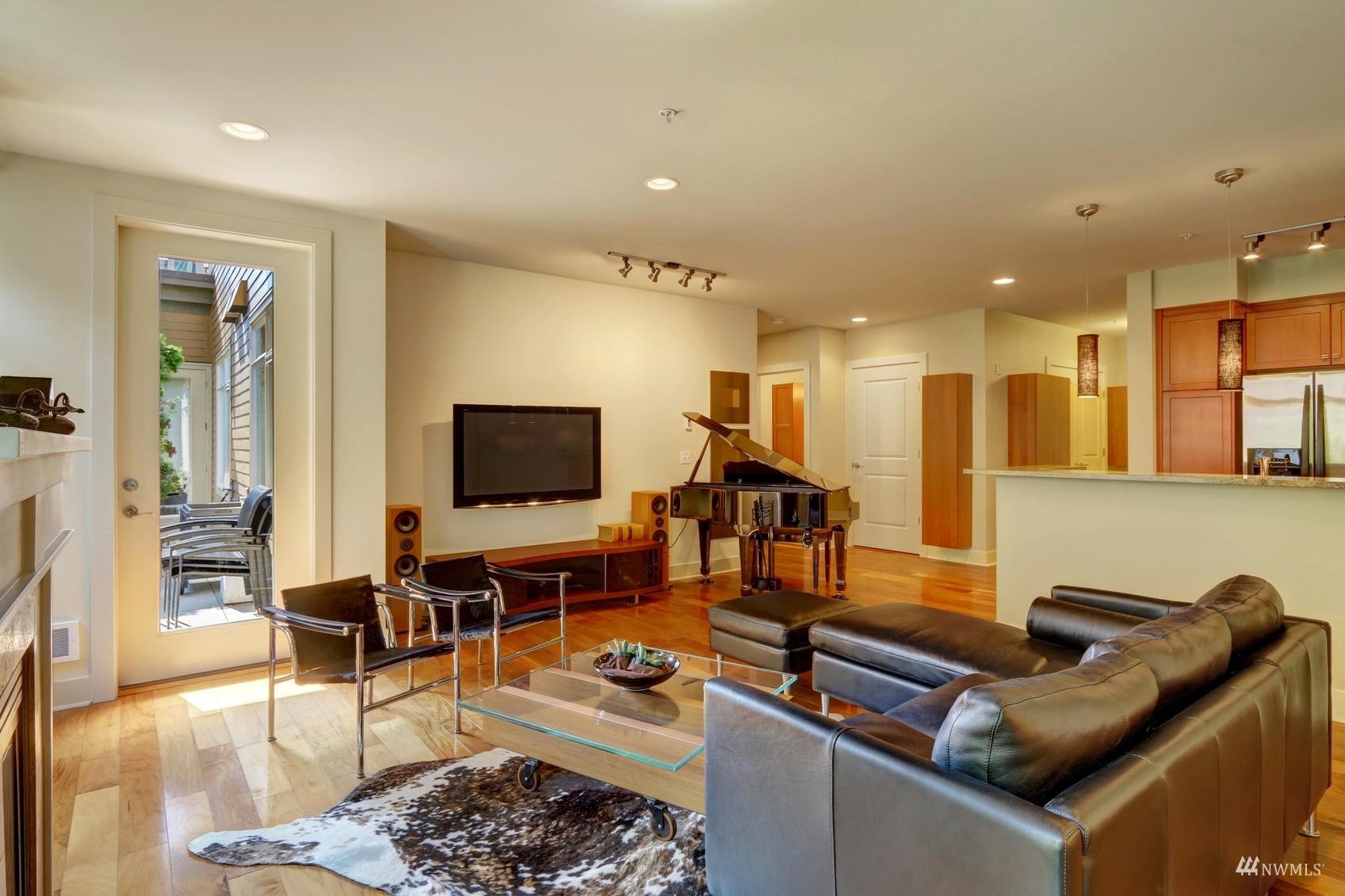 41 Pine Street, Unit 213 Edmonds, WA 98020 - Photo 7 of 25 a living room with furniture kitchen view and a large window