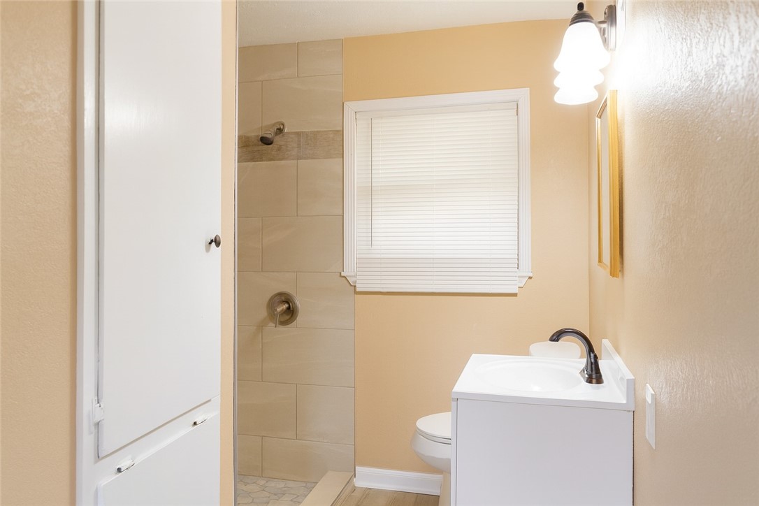 1122 Rickey Drive Corpus Christi, TX 78412 - Photo 3 of 8 a bathroom with a sink a toilet and shower