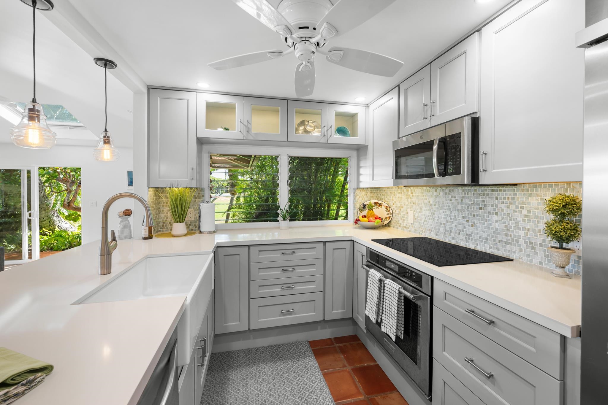 20 Hui Road East, Unit 35 Lahaina, HI 96761 - Photo 13 of 50 a kitchen with a sink stove and microwave