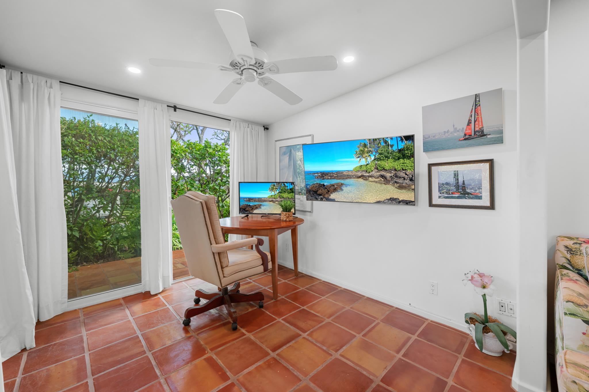 20 Hui Road East, Unit 35 Lahaina, HI 96761 - Photo 18 of 50 a work room with furniture a flat screen tv and a floor to ceiling window