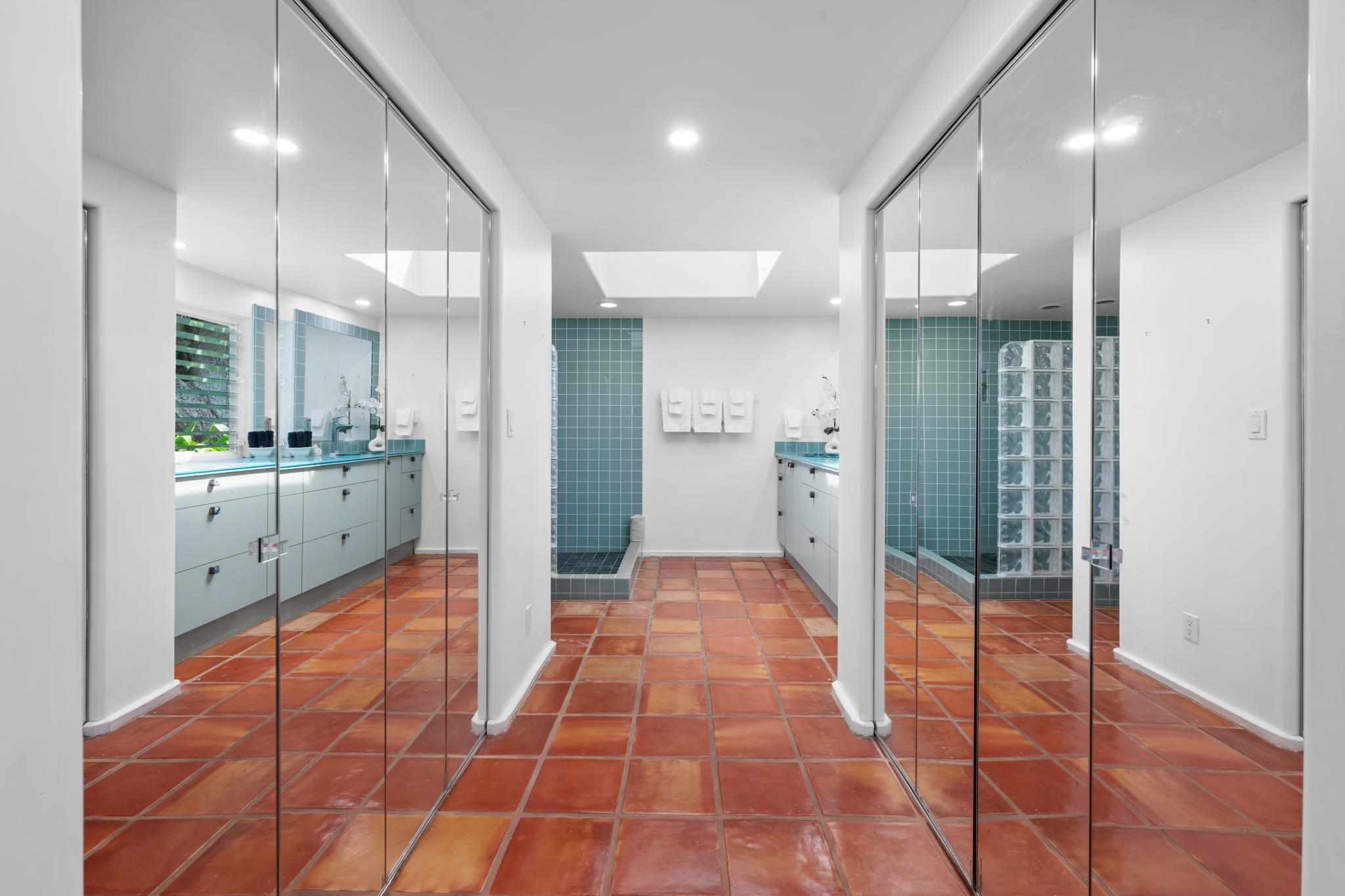 20 Hui Road East, Unit 35 Lahaina, HI 96761 - Photo 20 of 50 a bathroom with a glass shower door and a mirror