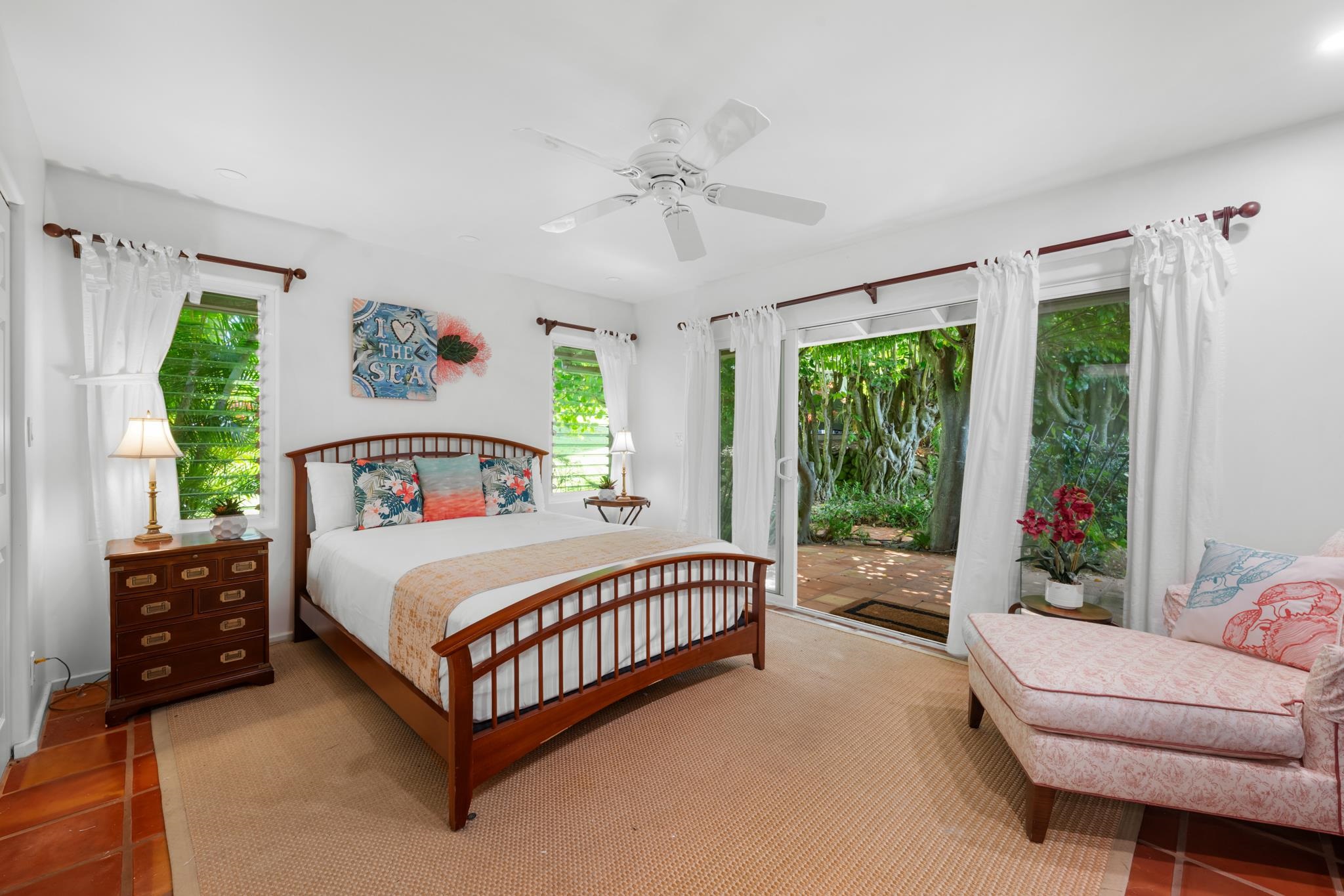 20 Hui Road East, Unit 35 Lahaina, HI 96761 - Photo 25 of 50 a bedroom with a bed couch and a large window