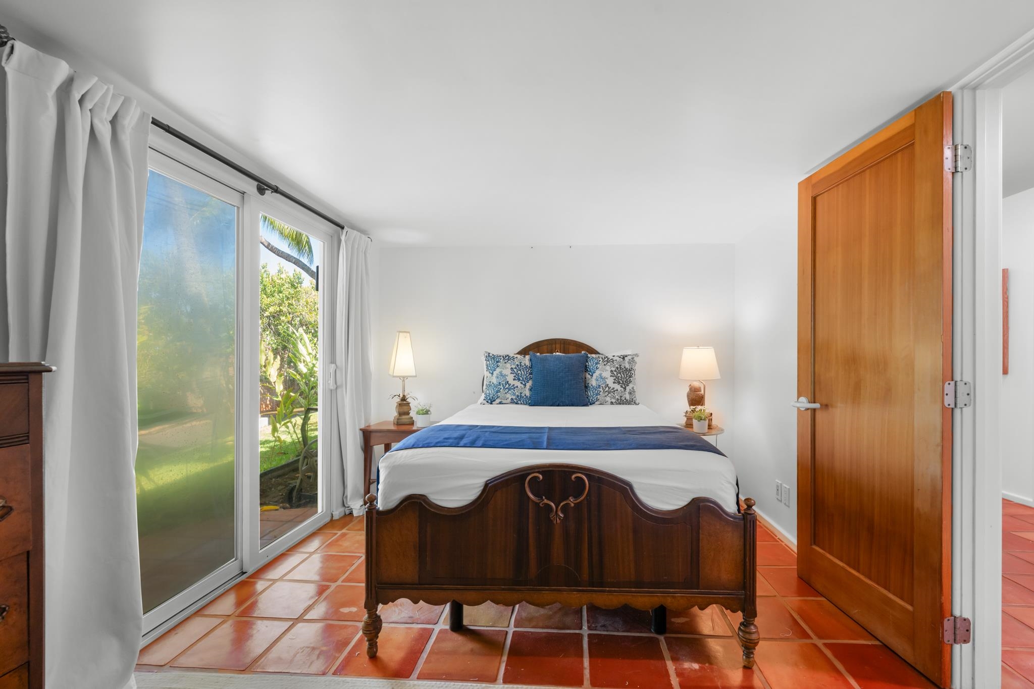 20 Hui Road East, Unit 35 Lahaina, HI 96761 - Photo 32 of 50 a bedroom with a bed and a mirror next to a window
