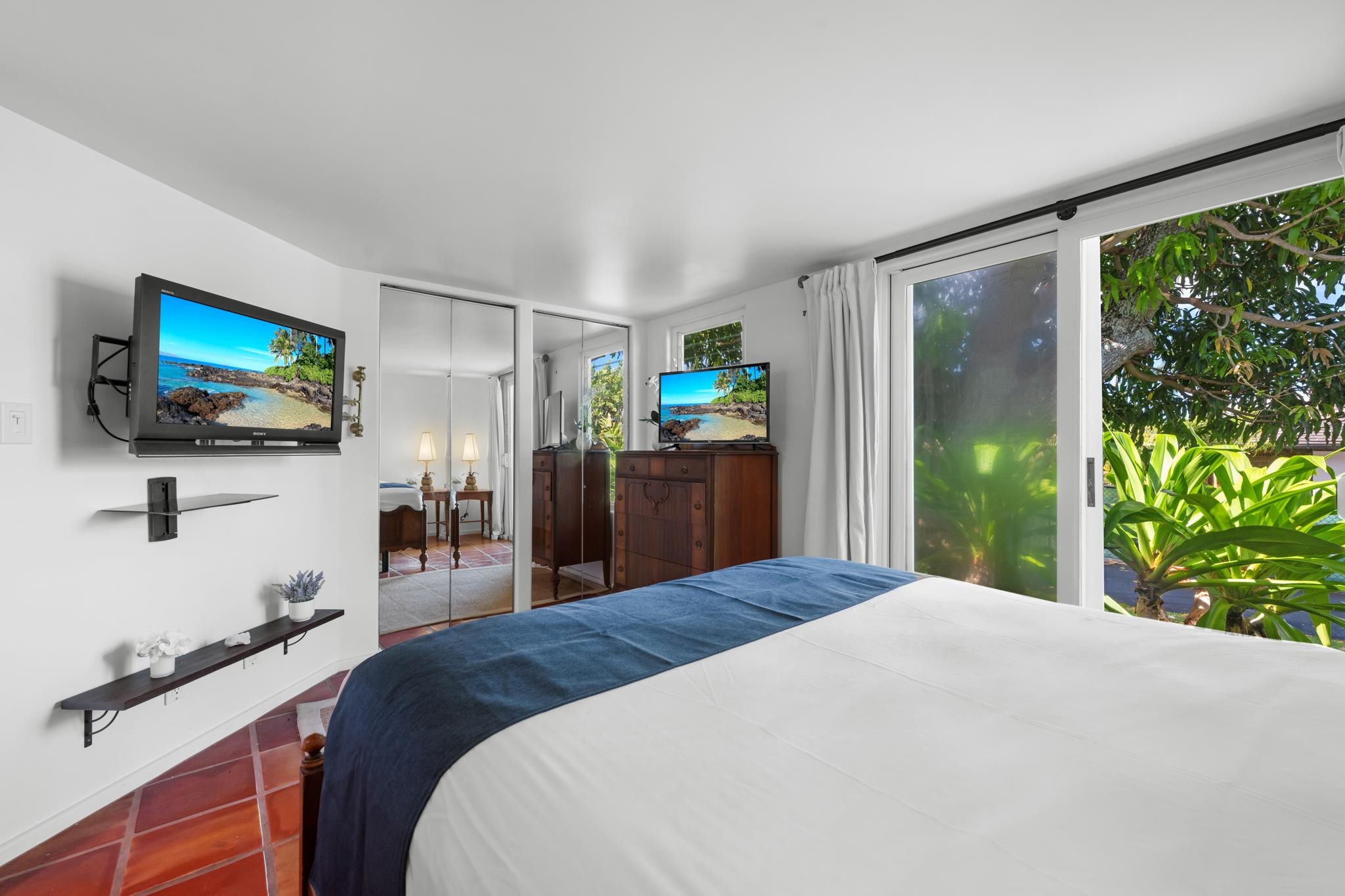 20 Hui Road East, Unit 35 Lahaina, HI 96761 - Photo 33 of 50 a bedroom with a bed and a flat screen tv