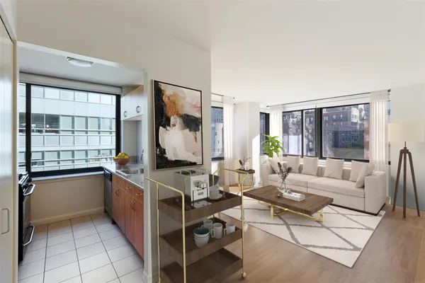 a living room with furniture a flat screen tv and a large window