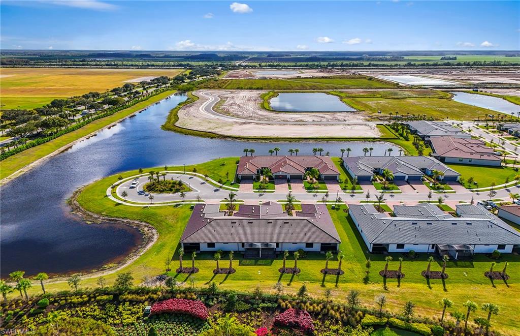 6407 Memorial Lane Ave Maria, FL 34142 - Photo 21 of 21 a view of swimming pool with outdoor seating and a garden