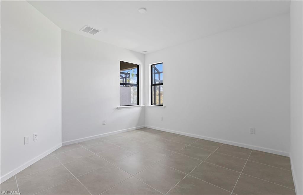 6407 Memorial Lane Ave Maria, FL 34142 - Photo 10 of 21 an empty room with windows