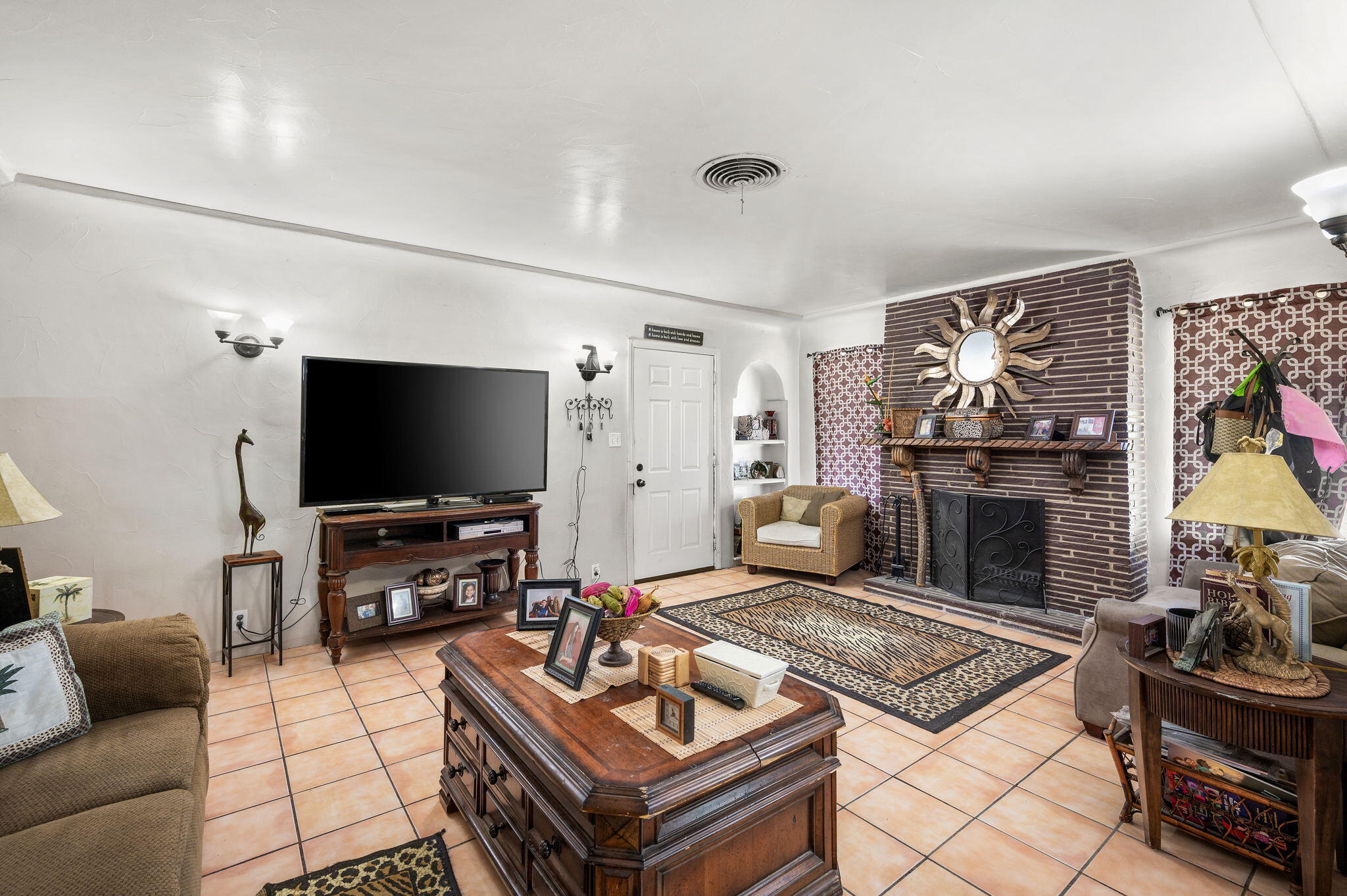 54521 Calhoun Street Thermal, CA 92274 - Photo 11 of 34 a living room with furniture and a flat screen tv