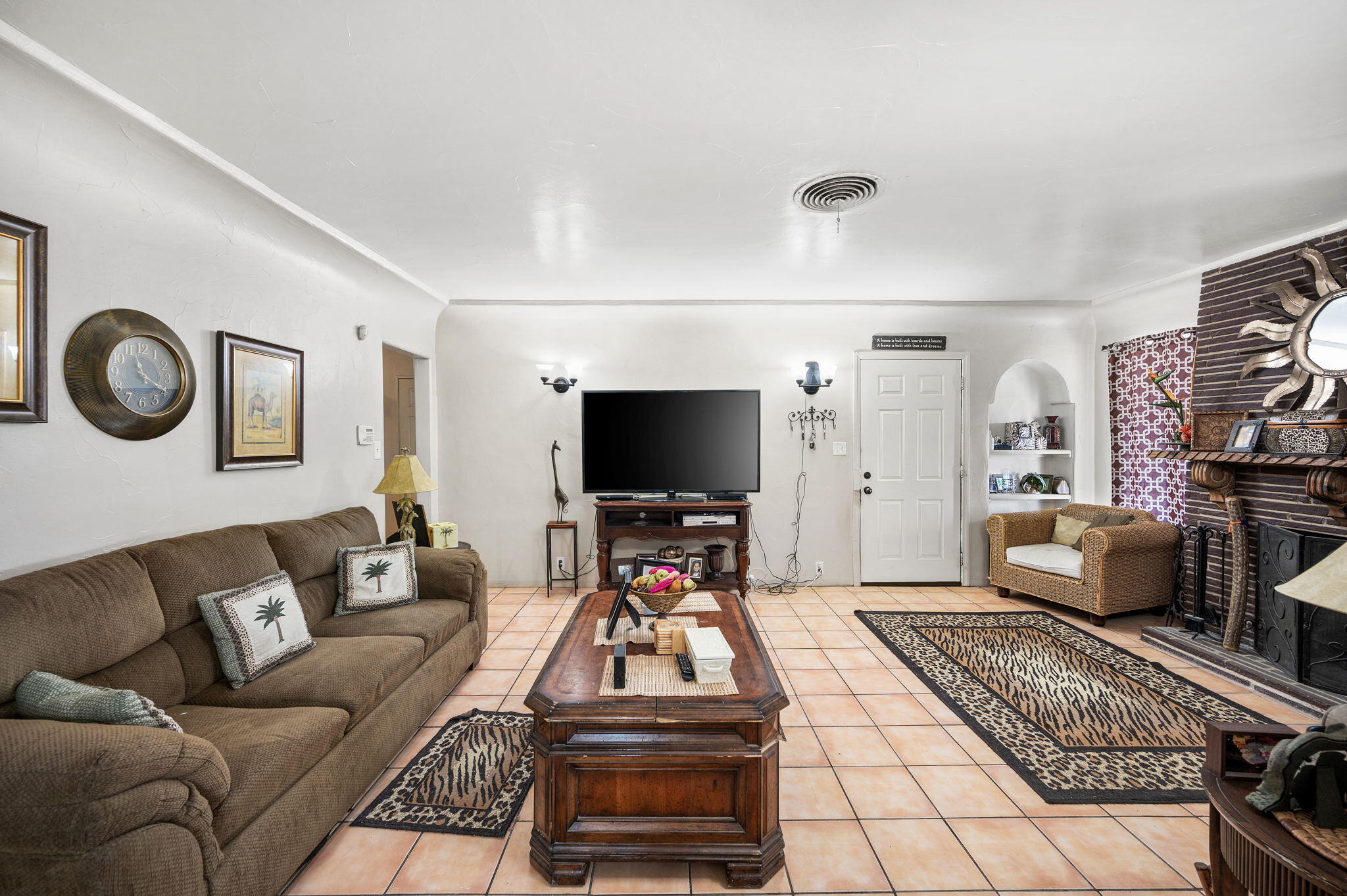 54521 Calhoun Street Thermal, CA 92274 - Photo 12 of 34 a living room with furniture and a flat screen tv