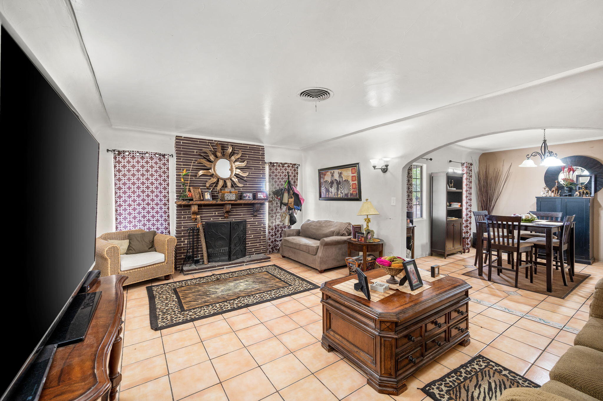 54521 Calhoun Street Thermal, CA 92274 - Photo 13 of 34 a living room with furniture and a fireplace