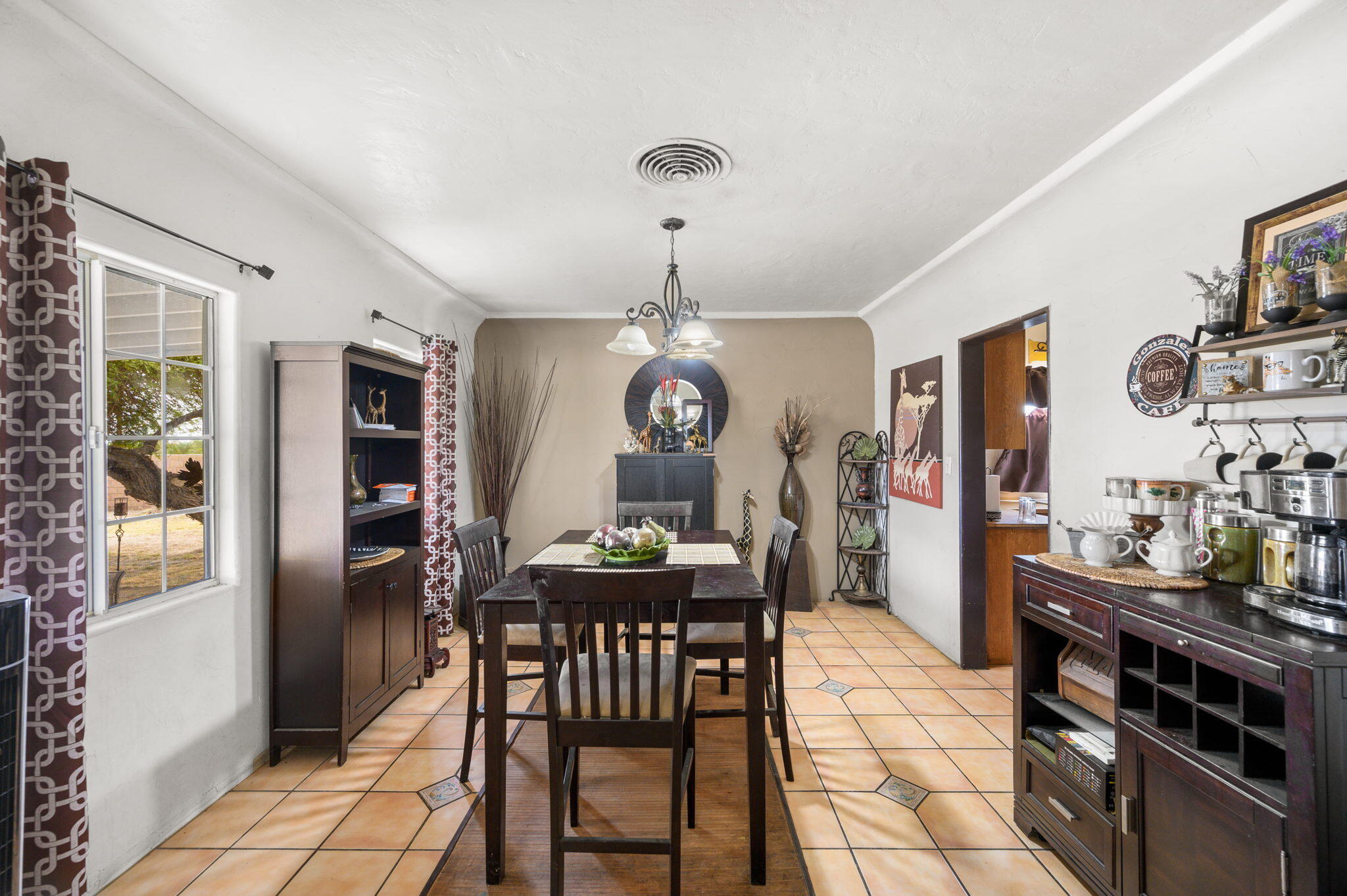 54521 Calhoun Street Thermal, CA 92274 - Photo 16 of 34 a view of a dining room with furniture and chandelier