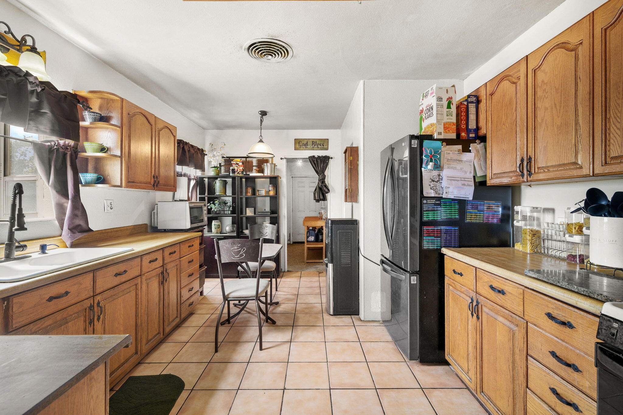54521 Calhoun Street Thermal, CA 92274 - Photo 18 of 34 a kitchen with stainless steel appliances granite countertop a refrigerator and a stove top oven