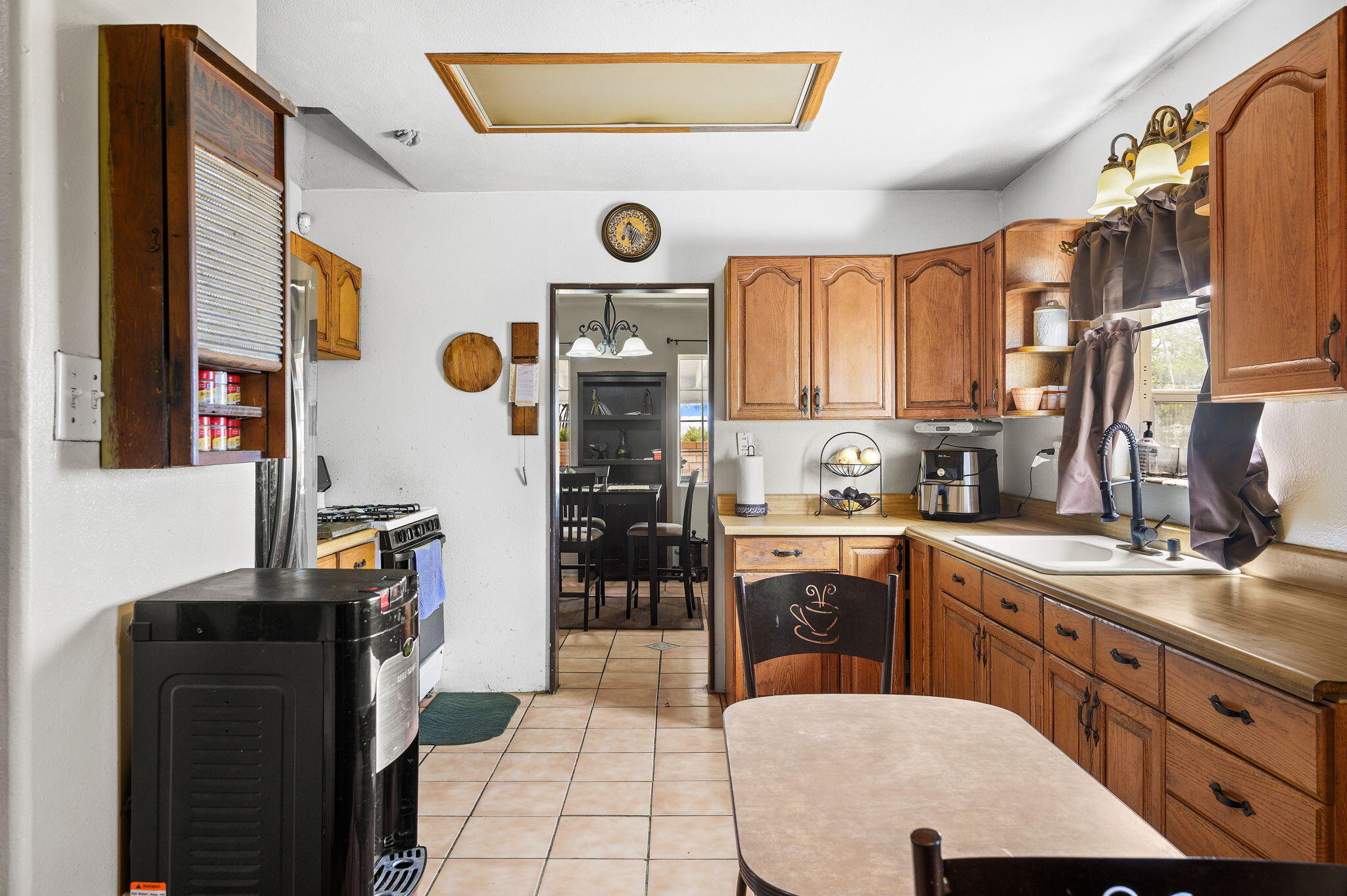 54521 Calhoun Street Thermal, CA 92274 - Photo 22 of 34 a kitchen with stainless steel appliances granite countertop a stove a sink and a refrigerator