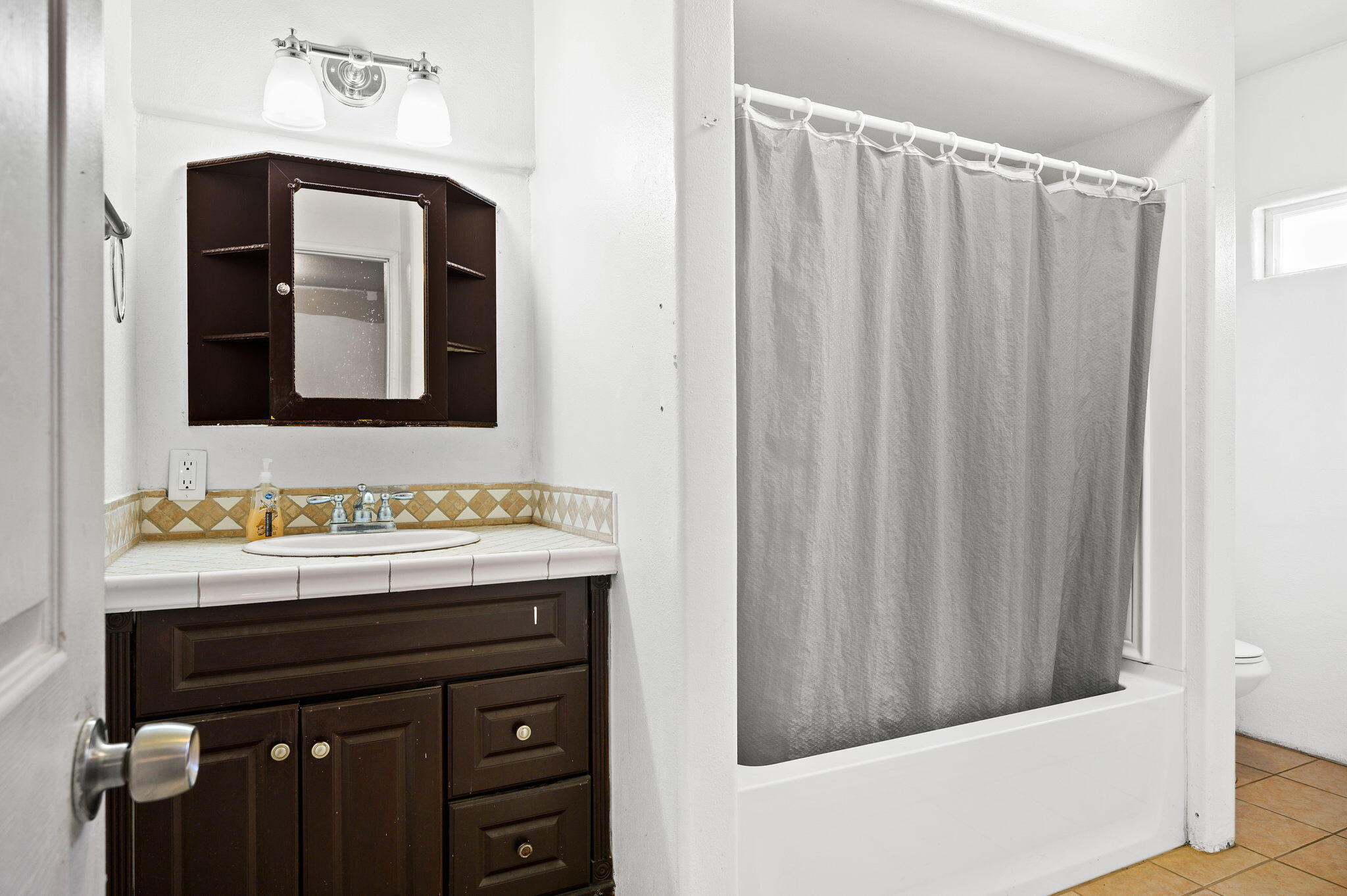54521 Calhoun Street Thermal, CA 92274 - Photo 25 of 34 a bathroom with a sink and a mirror