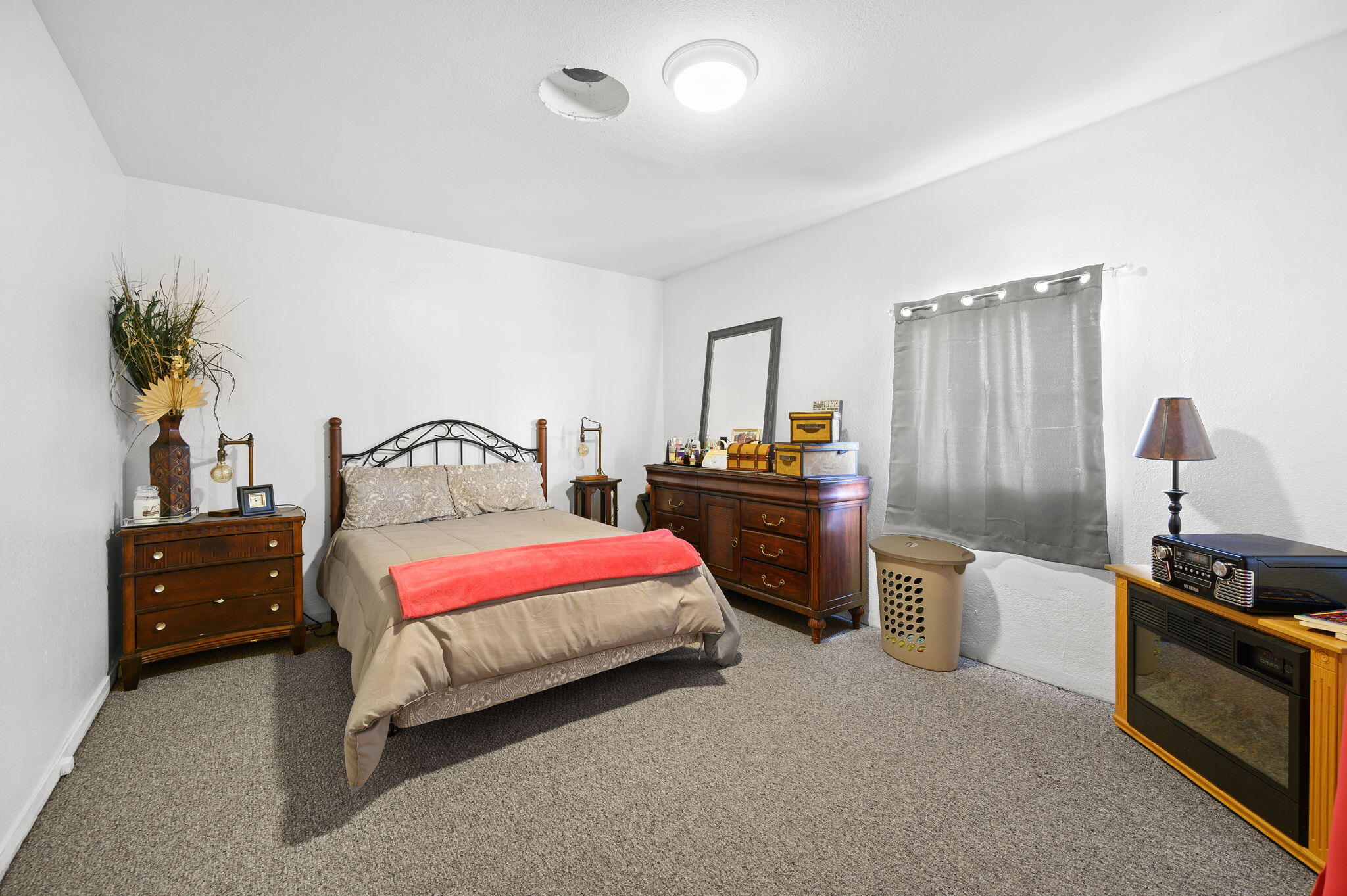54521 Calhoun Street Thermal, CA 92274 - Photo 29 of 34 a bedroom with a bed and a closet