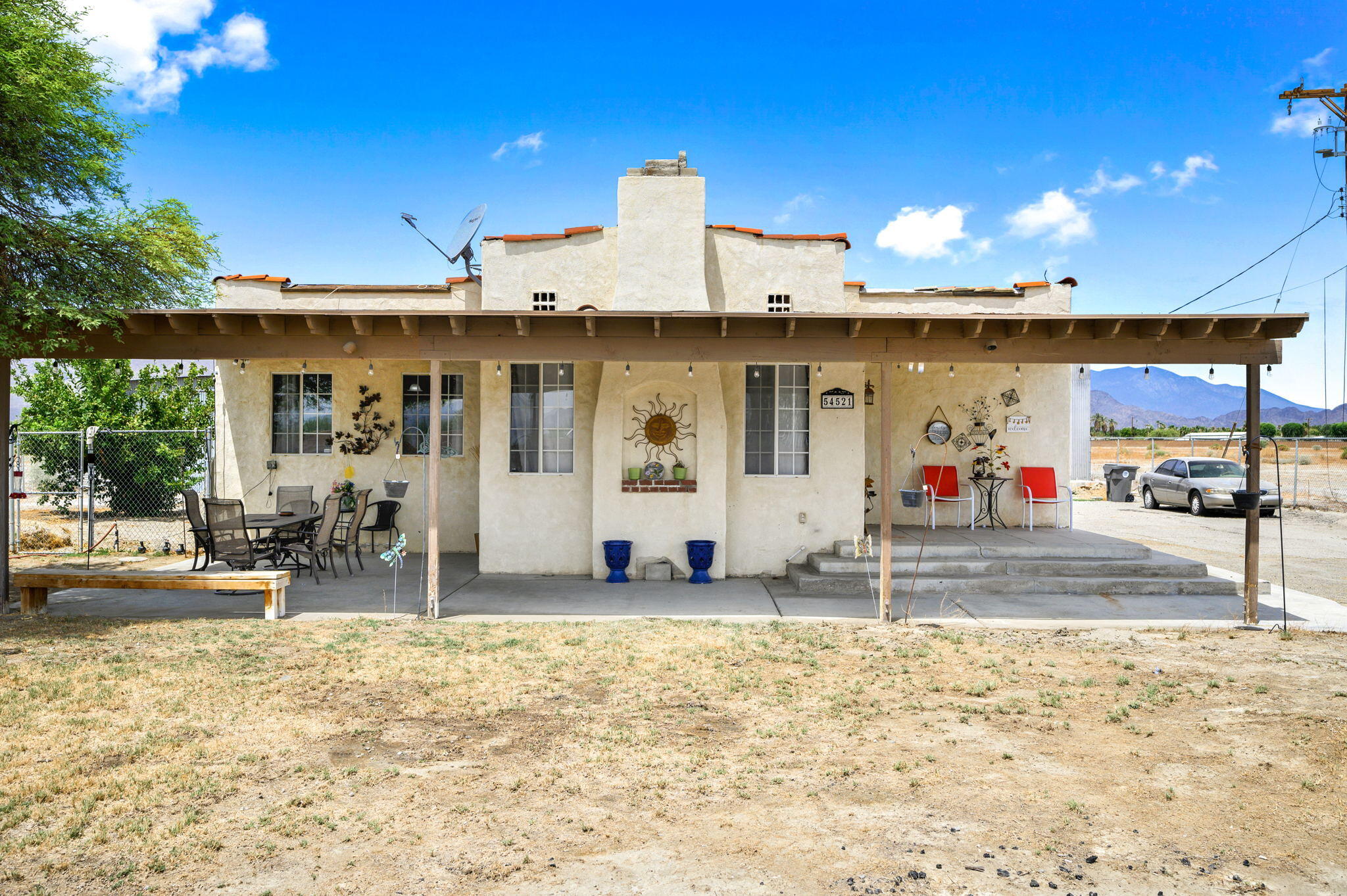 54521 Calhoun Street Thermal, CA 92274 - Photo 9 of 34 a view of a house with basket ball court and outdoor seating