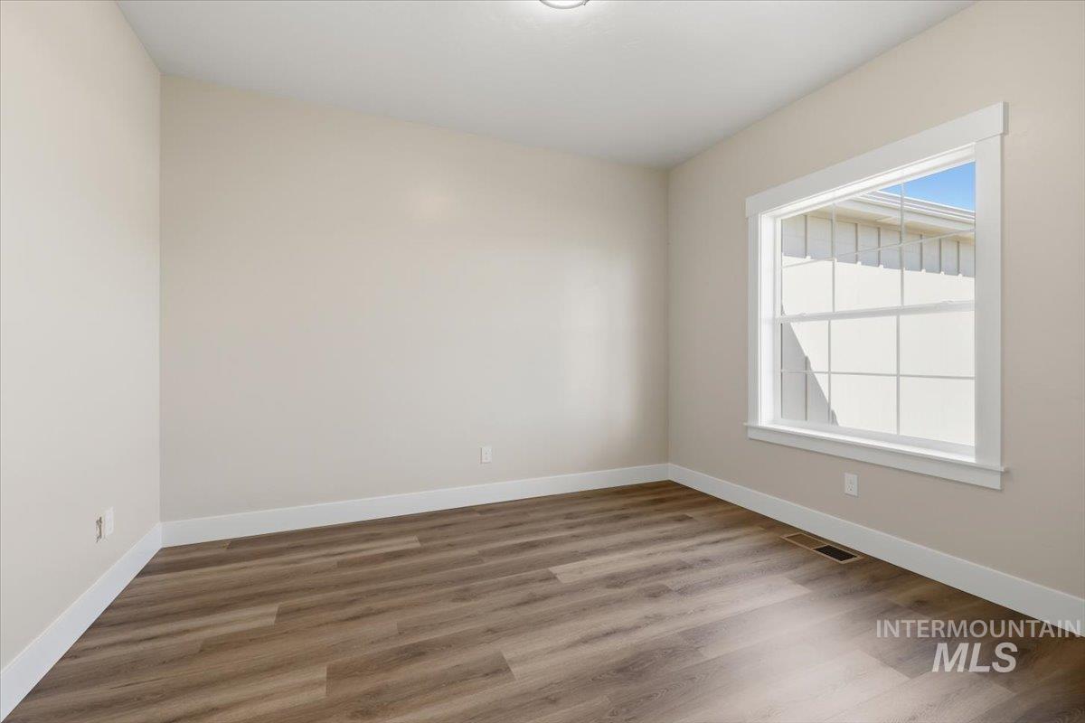 29343 Dixie Road Parma, ID 83660 - Photo 15 of 35 Unfurnished room with wood finished floors