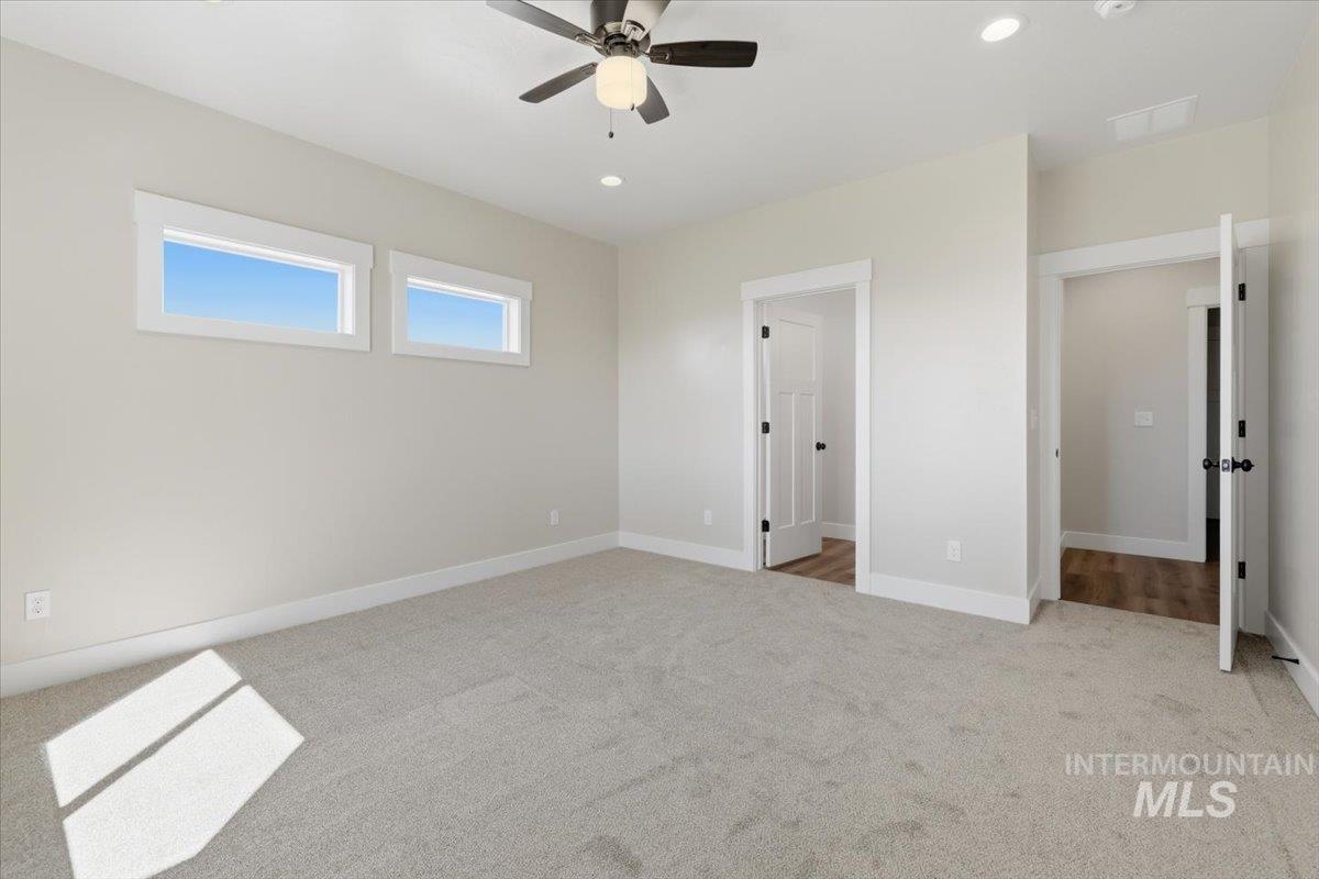 29343 Dixie Road Parma, ID 83660 - Photo 25 of 35 Unfurnished bedroom with light carpet, recessed lighting, and a ceiling fan