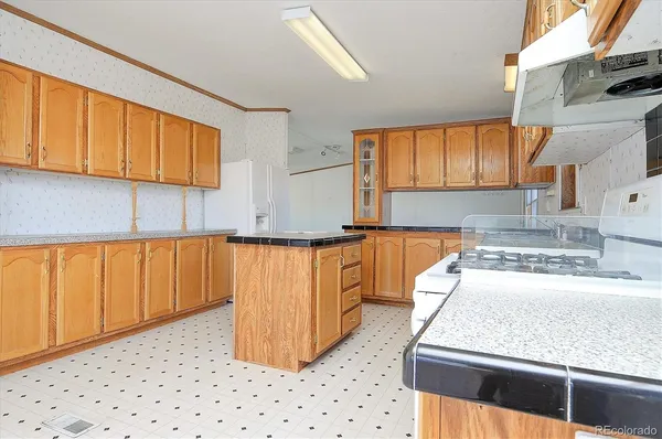 a kitchen with sink and cabinets