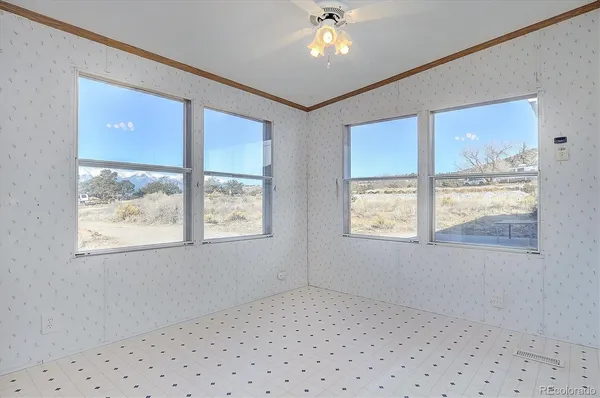 a view of an empty room with a window