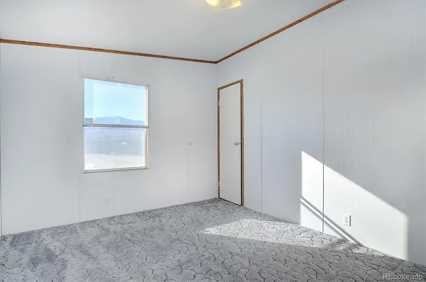 a view of an empty room with windows