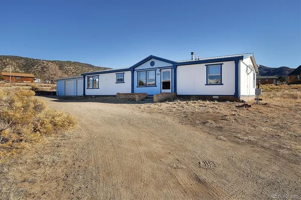 a house view with a wooden fence