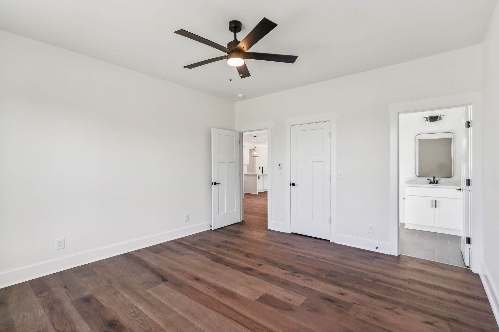 4050 Chicken Road Lebanon, TN 37090 - Photo 35 of 65 an empty room with wooden floor and a ceiling fan