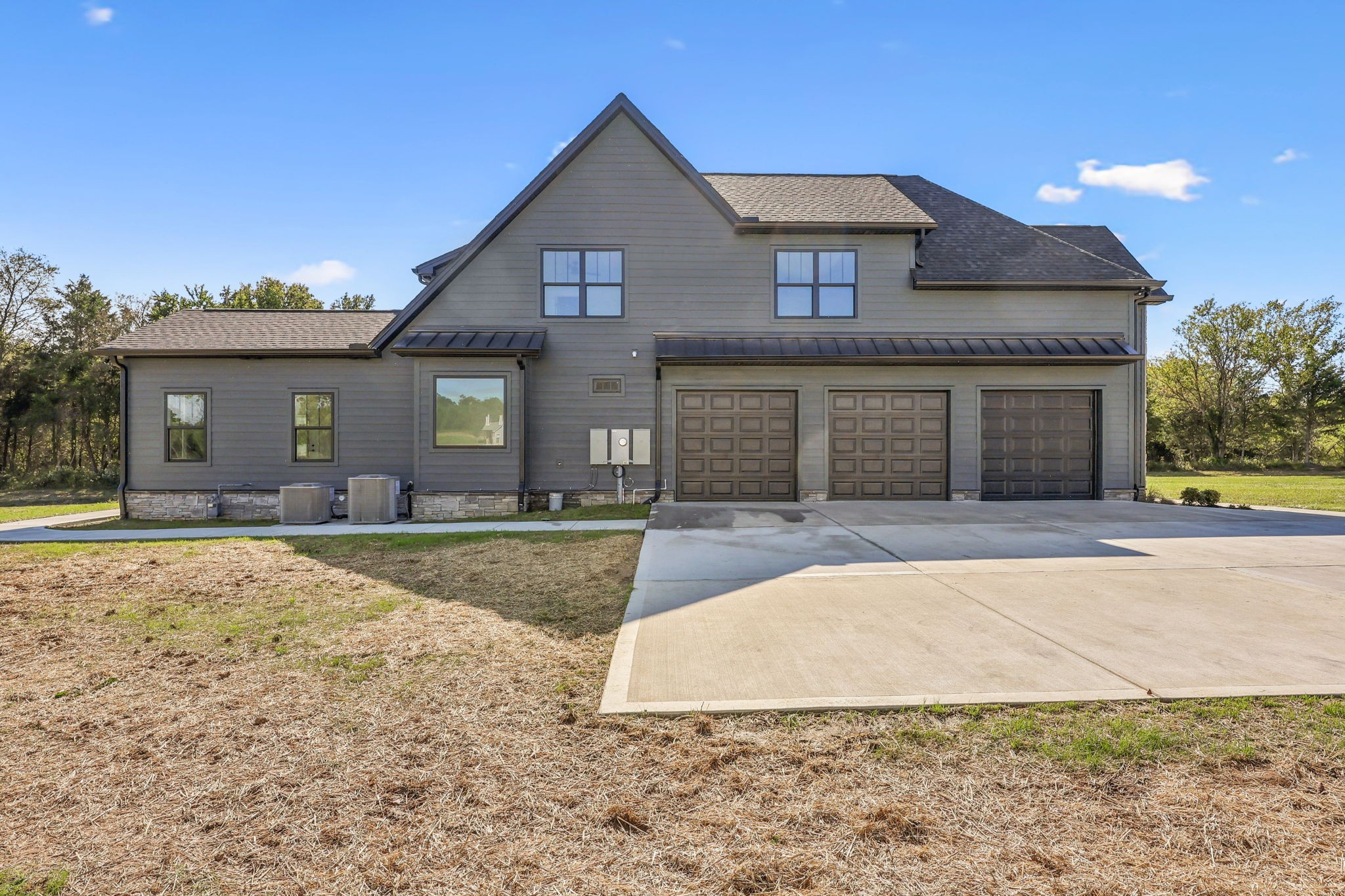 4050 Chicken Road Lebanon, TN 37090 - Photo 60 of 65 a front view of a house with a yard and garage